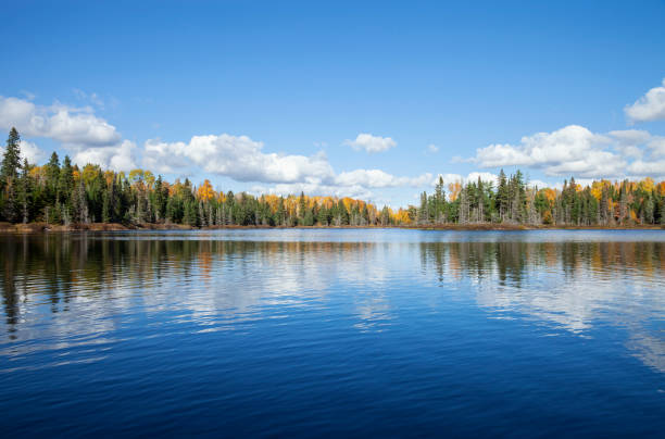 Calm Wisconsin lake with autumn foliage