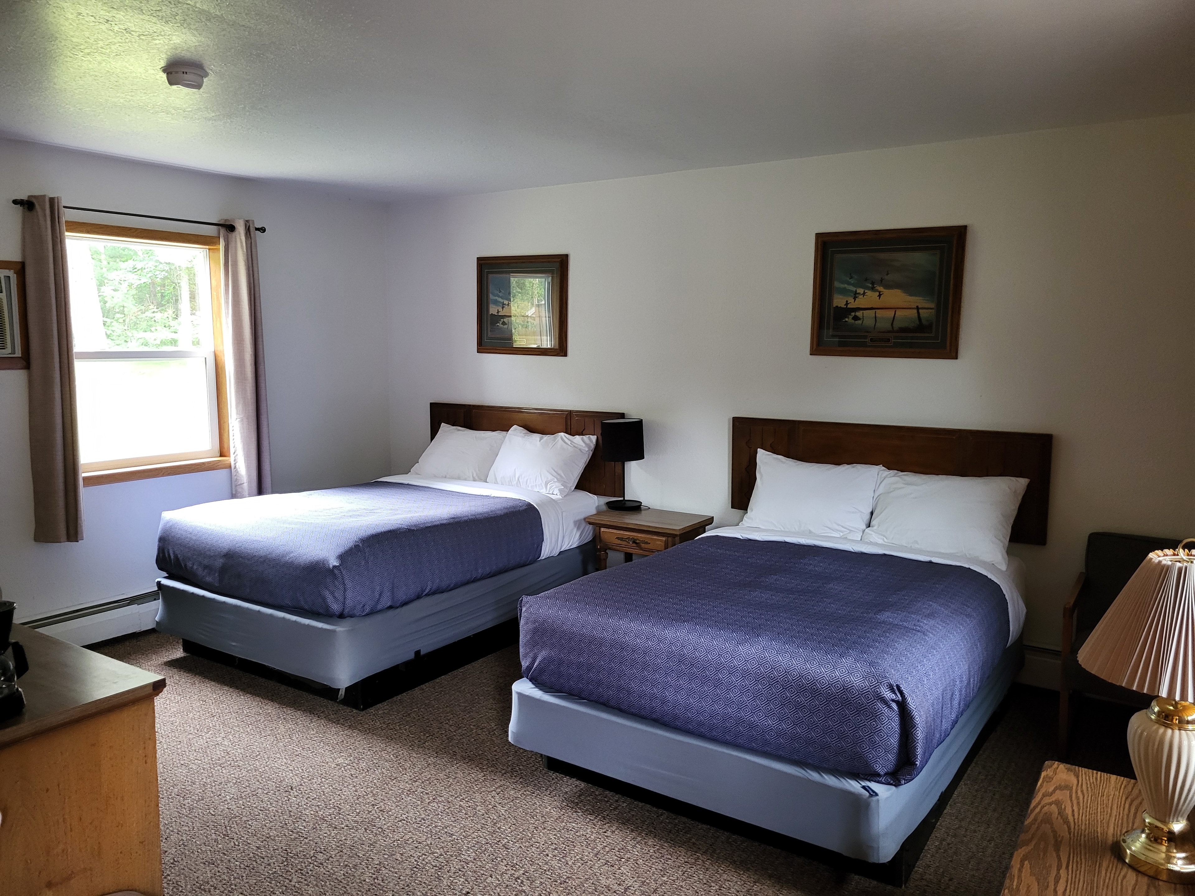 Pine Wood Motel Room 15 — two beds with cozy bedding
